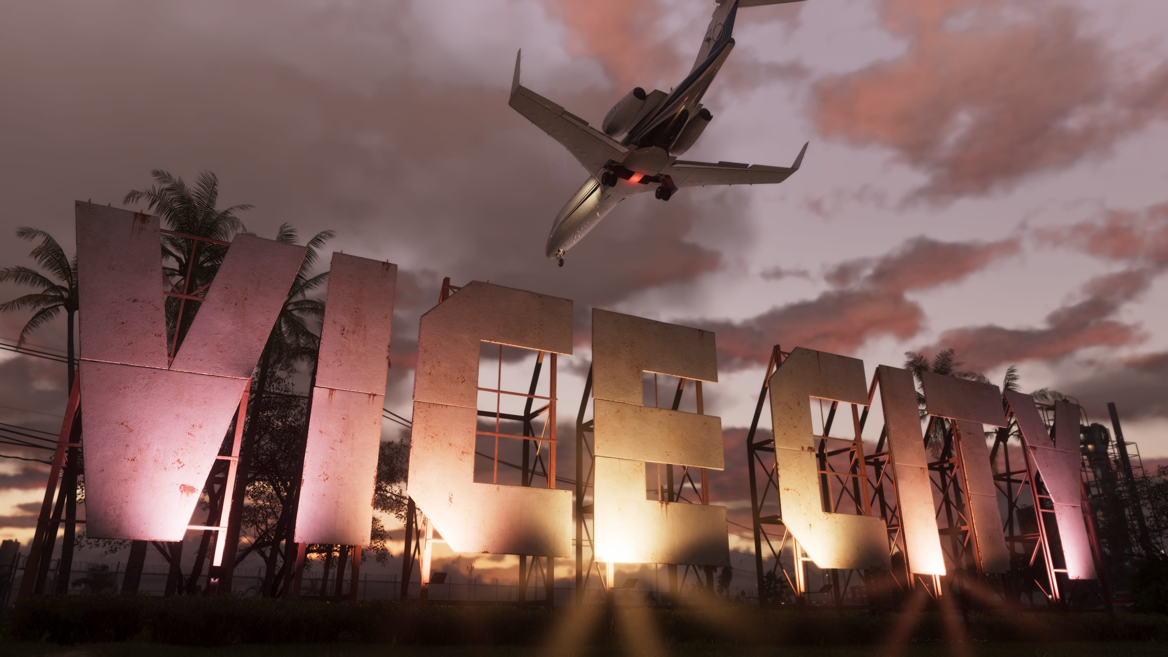 The Vice City sign beneath a jet at sunset.
